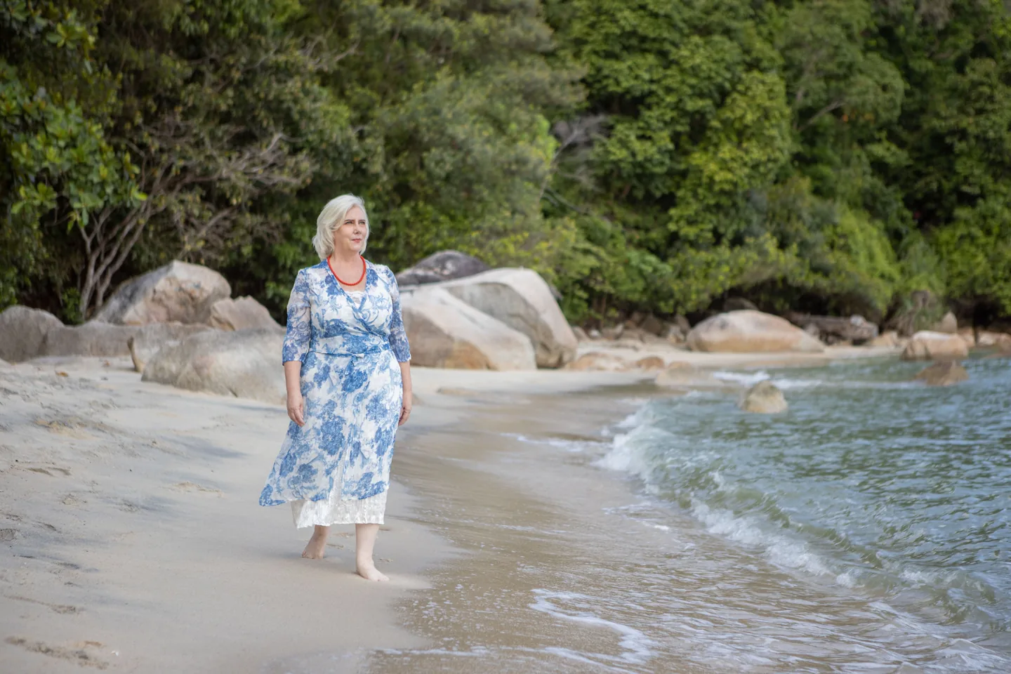 Joanne Flinn — keynote speaker and ESG strategist, walking on the beach — seeing further